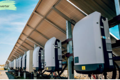 Large solar inverters installed beneath solar panel arrays in a commercial solar power plant