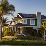 Residential solar panels installed on a house rooftop showing solar panel for home price, system capacity, battery storage, and inverter solutions.