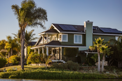 Residential solar panels installed on a house rooftop showing solar panel for home price, system capacity, battery storage, and inverter solutions.