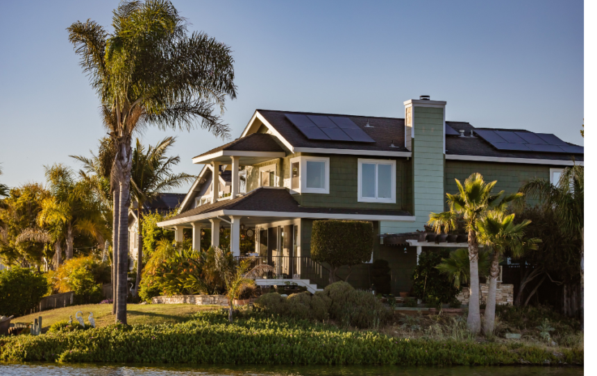 Residential solar panels installed on a house rooftop showing solar panel for home price, system capacity, battery storage, and inverter solutions.