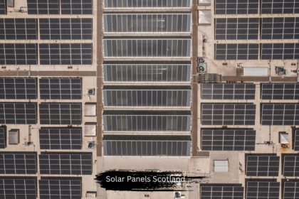 Aerial top down view of a massive commercial rooftop installation of solar panels Scotland, capturing clean renewable energy for sustainable power generation.