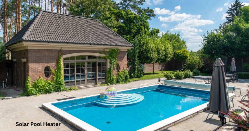 A backyard swimming pool with clear blue water next to a brick pool house, kept warm using a solar pool heater.