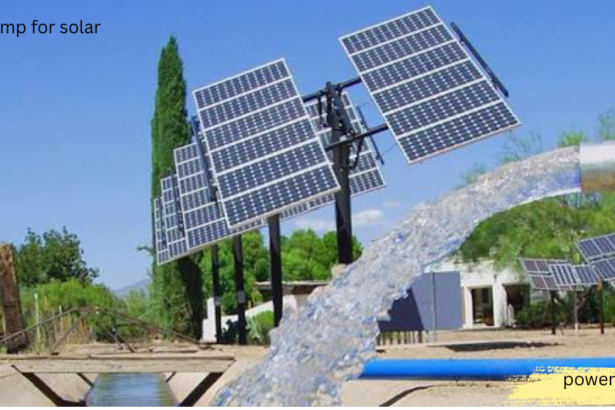 Water pump for solar system with tilted solar panels pumping water through a blue pipe on a farm