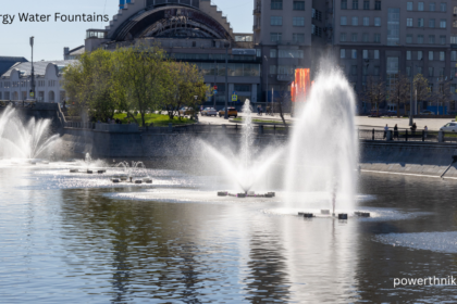 Solar energy water fountains with cascading water in a landscaped UK garden