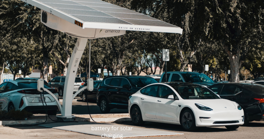 Battery for solar charging: solar-powered EV charging station with a white Tesla parked beside it