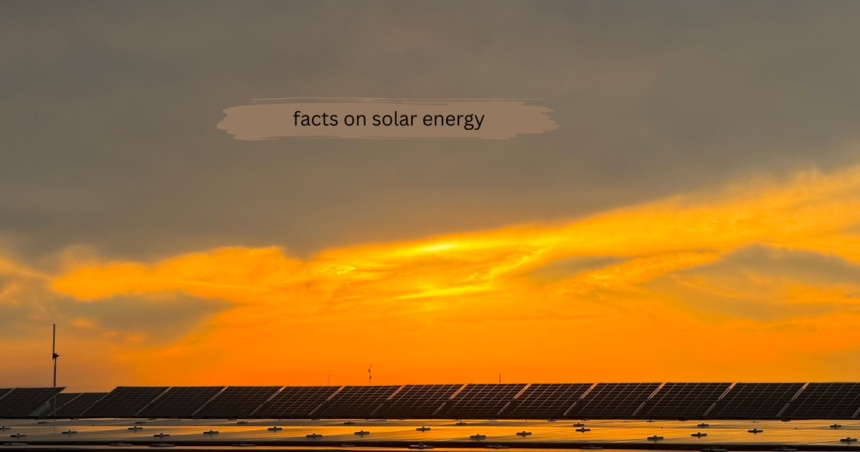Rows of solar panels stretching across a field under a vibrant orange sunset sky, with a 'facts on solar energy' text overlay