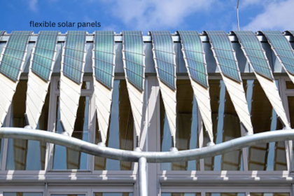Flexible solar panels installed at angled intervals along a modern building's roofline.