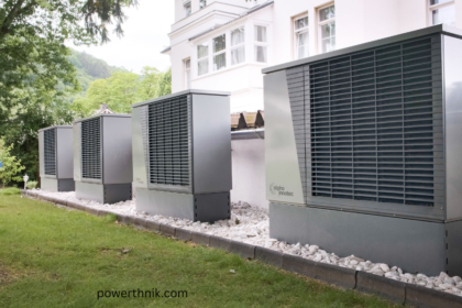 Row of modern Alpha Innotec air source heat pumps installed outside a building, provided by professional air source heat pump installers near me.