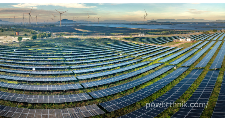 Lidl solar panels style large solar farm with wind turbines at sunset