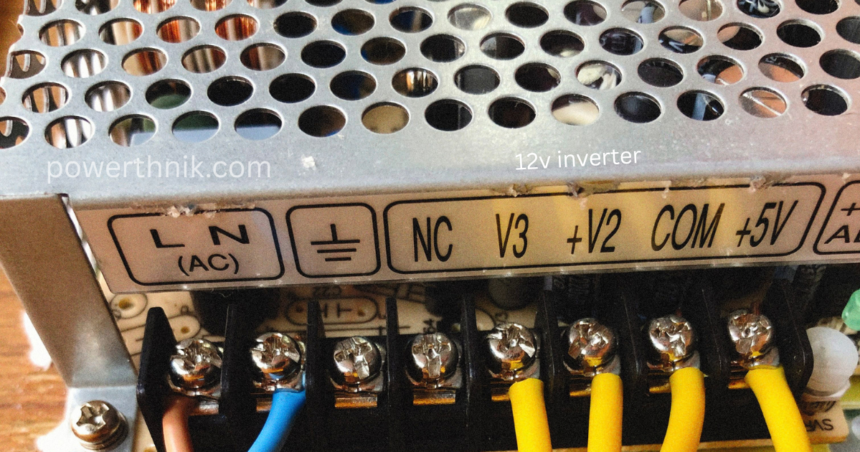 12v inverter power supply terminal block showing AC input L N, ground, and NC, V3, +V2, COM, +5V output connections with yellow wires.